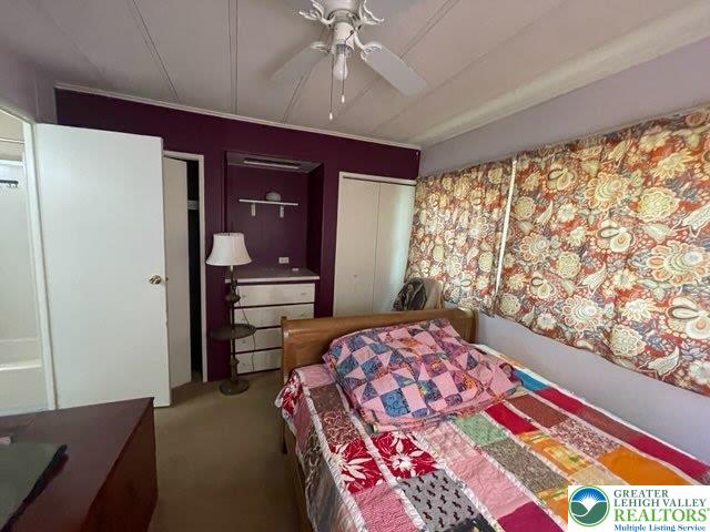 10 Springridge Road Bath, PA 18014 - Photo 10 of 20 a bedroom with a bed and a chandelier