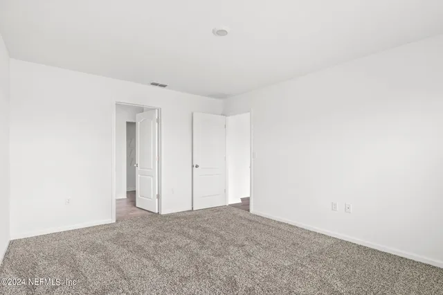 a bathroom with a bathtub a sink a vanity and a shower
