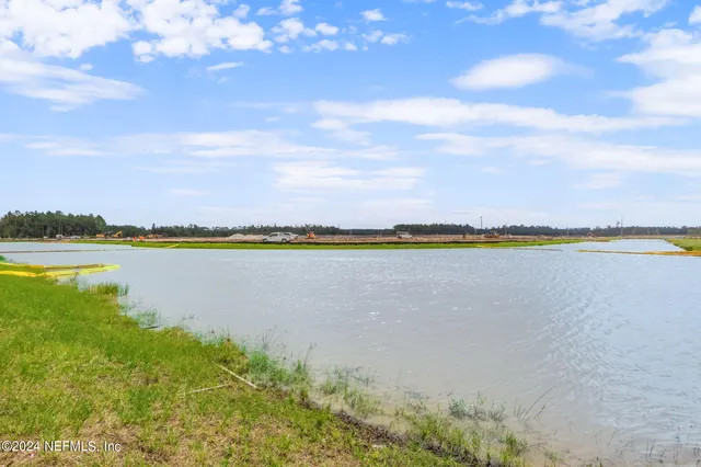 a view of a fountain in front of a house