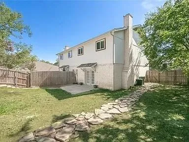 a view of a back yard of the house