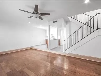 a view of an entryway with wooden floor