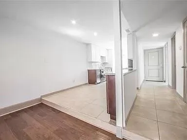 a view of a kitchen cabinets and wooden floor