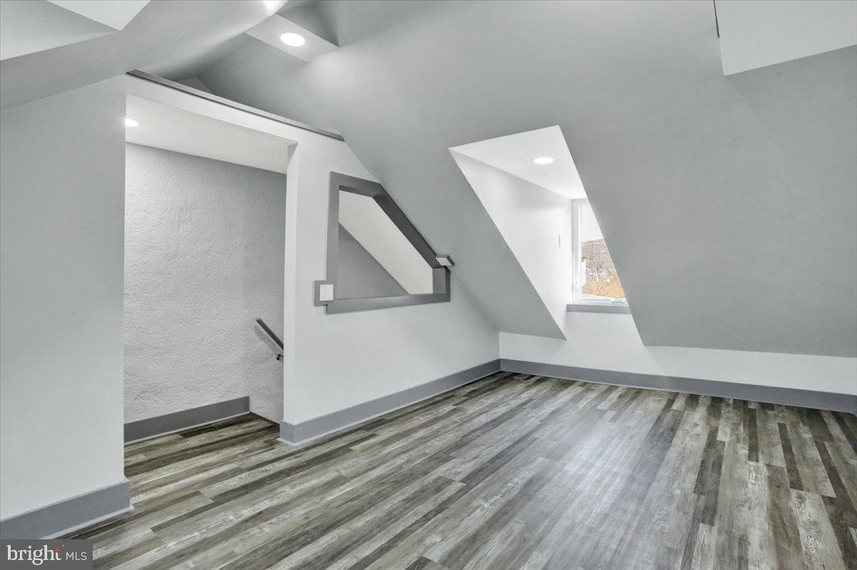 553 Wunder Street, Unit 2 Reading, PA 19602 - Photo 17 of 20 a view of an empty room with wooden floor and a window