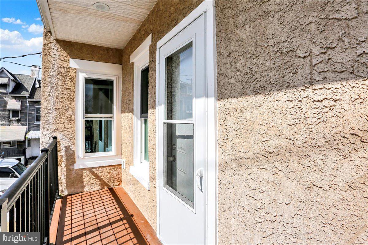 553 Wunder Street, Unit 2 Reading, PA 19602 - Photo 3 of 20 a view of a brick house with a large window