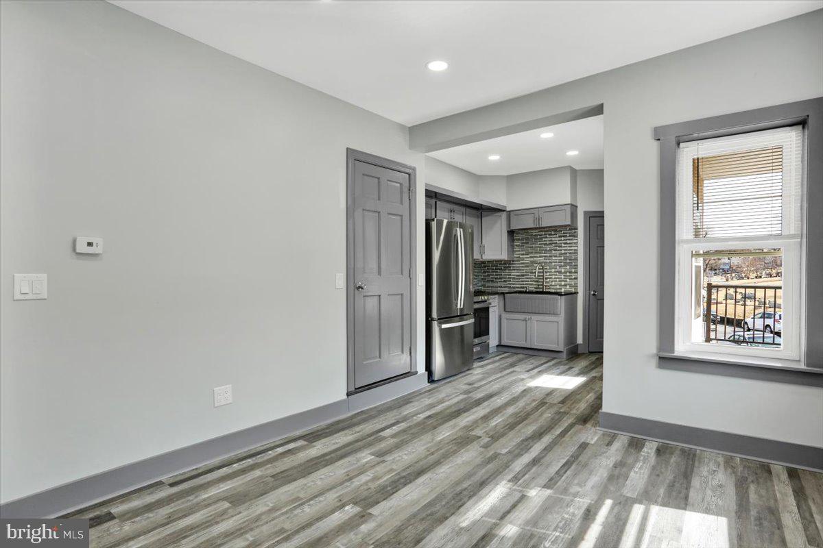 553 Wunder Street, Unit 2 Reading, PA 19602 - Photo 9 of 20 a view of a kitchen cabinets wooden floor and a window