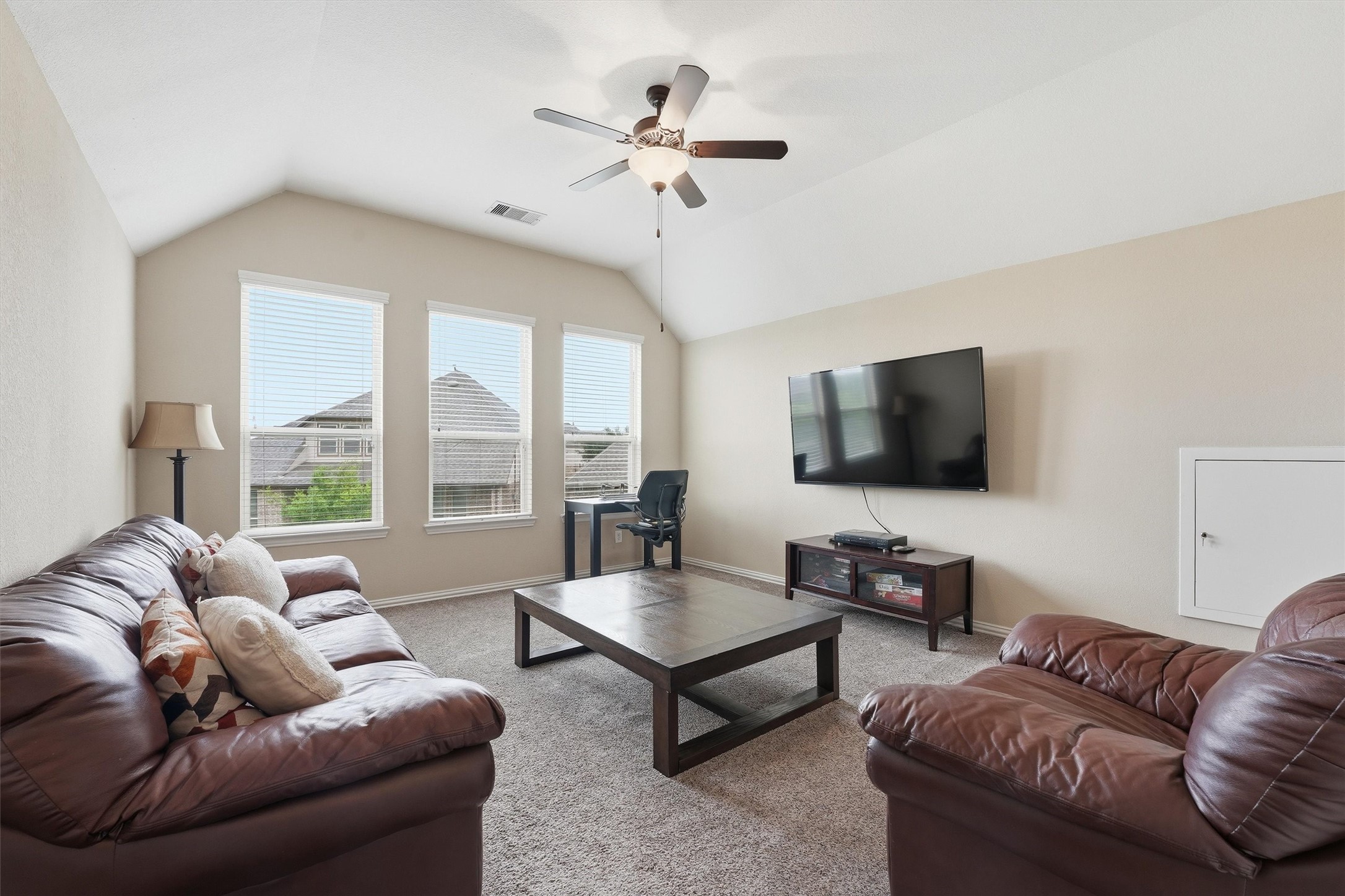12506 Northpointe Ridge Lane Tomball, TX 77377 - Photo 20 of 31 a living room with furniture and a flat screen tv
