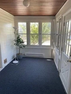a view of an empty room with a window