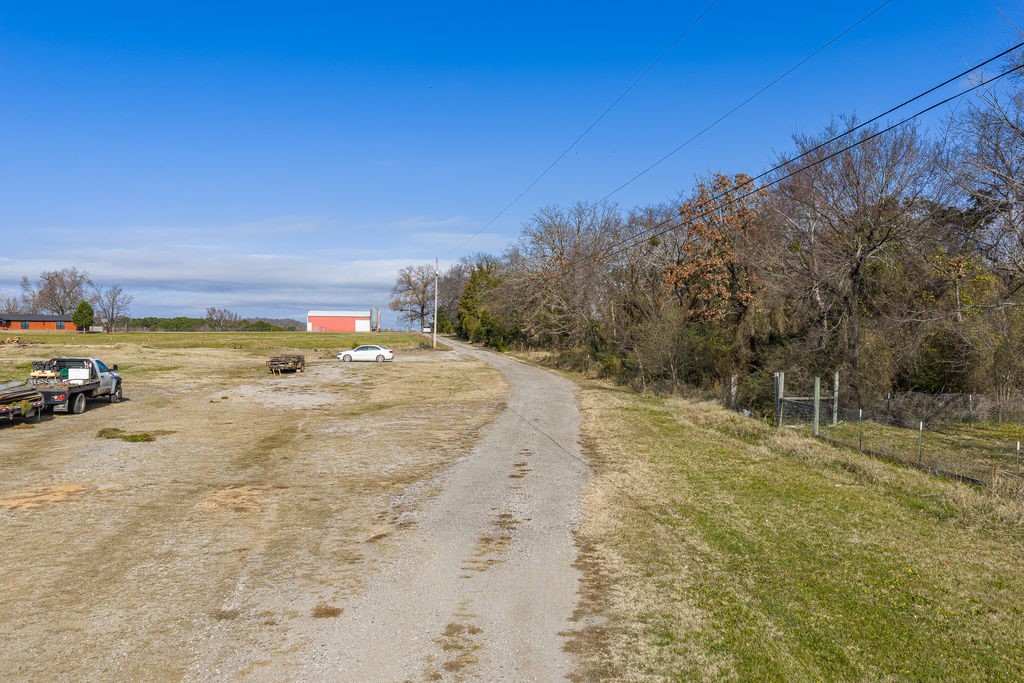 3022 Dow Jones Road Alma, AR 72921 - Photo 32 of 34 View of dirt / gravel road with a view of countryside