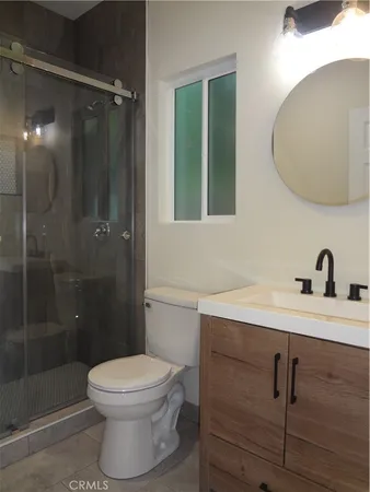 a bathroom with a shower and a toilet