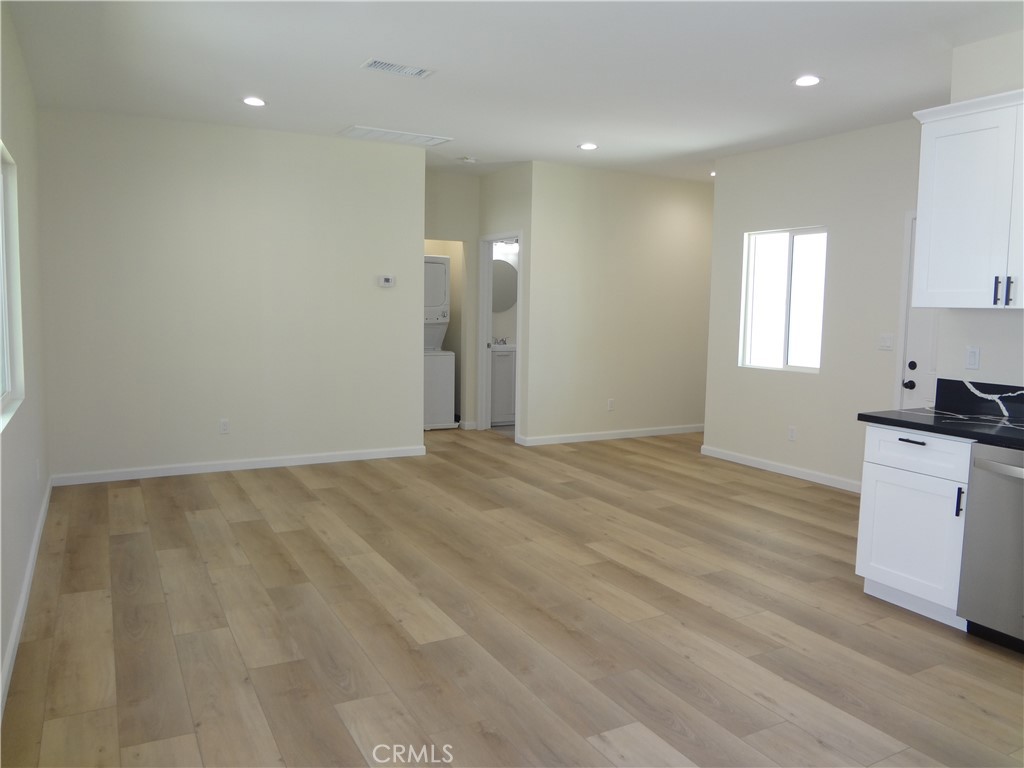 1717 2nd Street San Fernando, CA 91340 - Photo 4 of 18 a view of a room with a sink cabinets and wooden floor