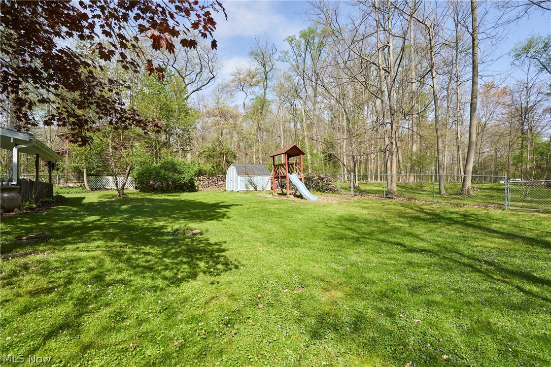 3097 Baughman Road Clinton, OH 44216 - Photo 27 of 27 Expansive green lawn with mature trees bordering the property
