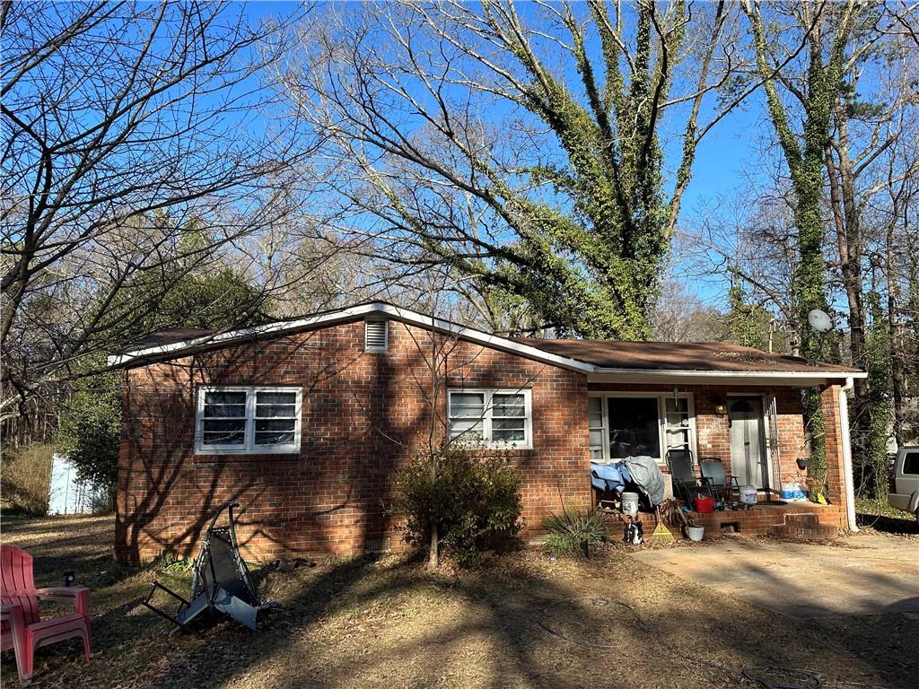 927 Fairview Road Stockbridge, GA 30281 - Photo 1 of 1 a view of a house with a patio