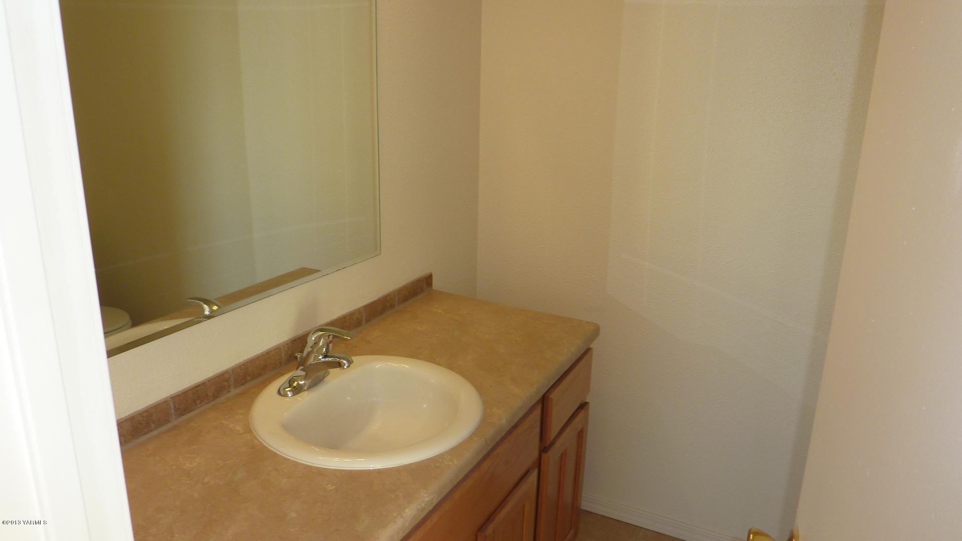 10030 Mieras Road Yakima, WA 98901 - Photo 15 of 23 a bathroom with a sink and a mirror