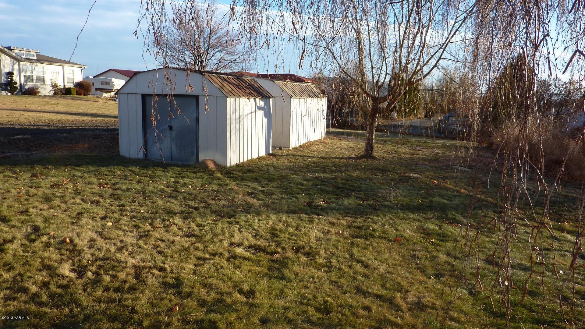 10030 Mieras Road Yakima, WA 98901 - Photo 21 of 23 a view of a house with a yard