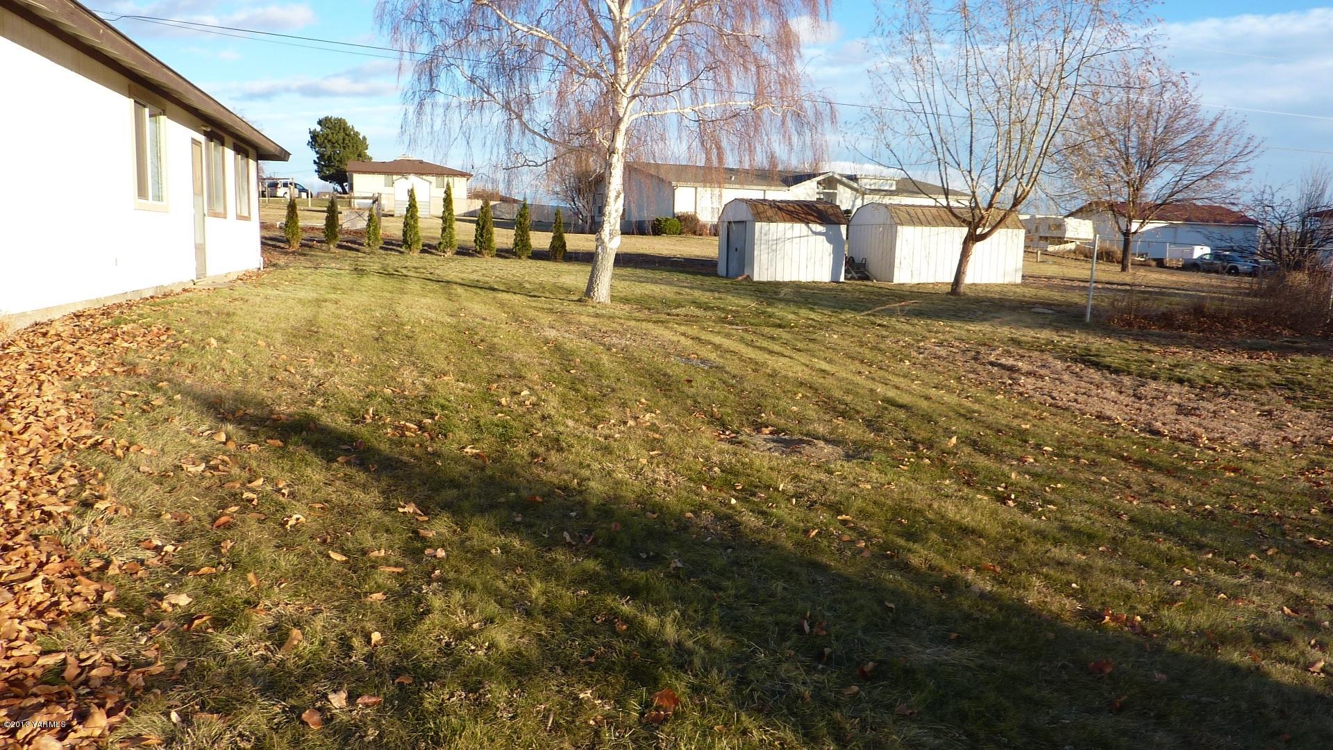 10030 Mieras Road Yakima, WA 98901 - Photo 22 of 23 a view of a yard with some trees