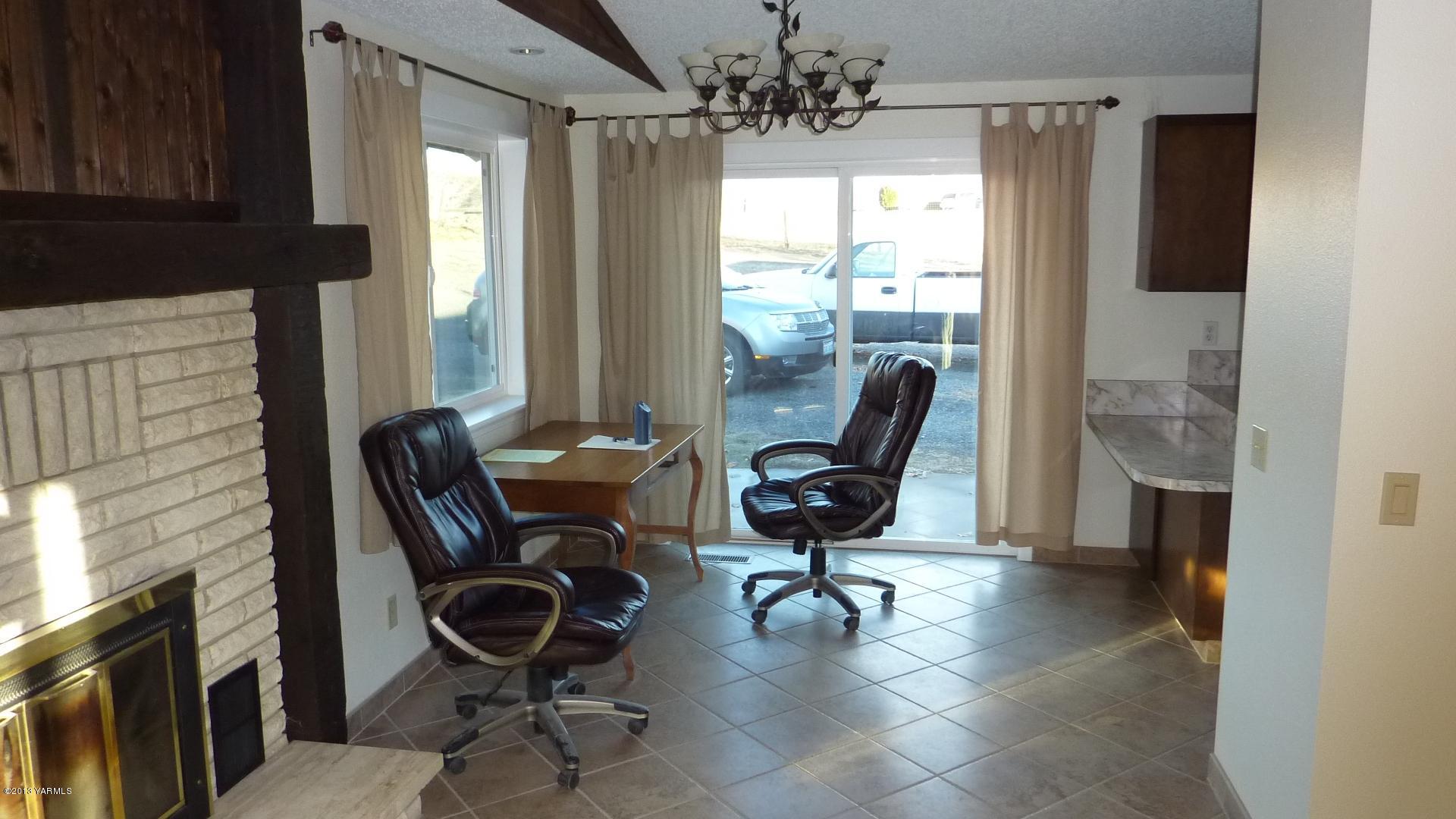10030 Mieras Road Yakima, WA 98901 - Photo 4 of 23 a view of a workspace with furniture and a window