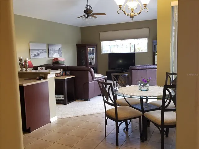 a kitchen with a stove a sink and a refrigerator