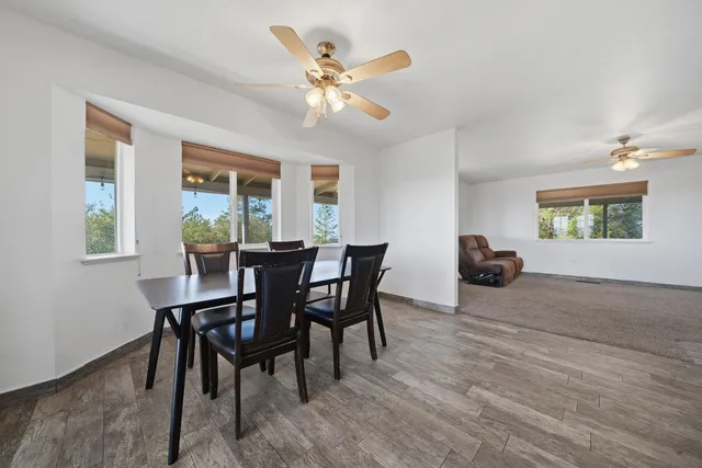 a kitchen with stainless steel appliances granite countertop a stove a sink dishwasher and a microwave oven with cabinets