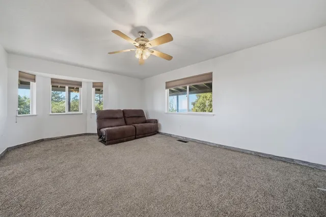 a view of kitchen with wooden floor and electronic appliances