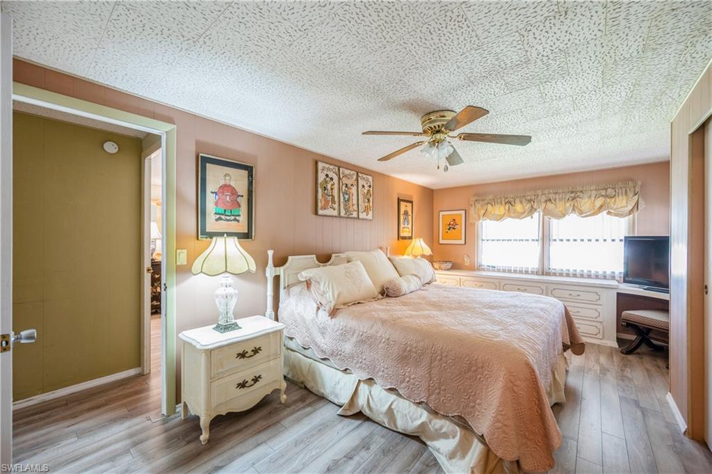 32 Monaco Terrace Naples, FL 34112 - Photo 12 of 19 a bed room with bed and a window