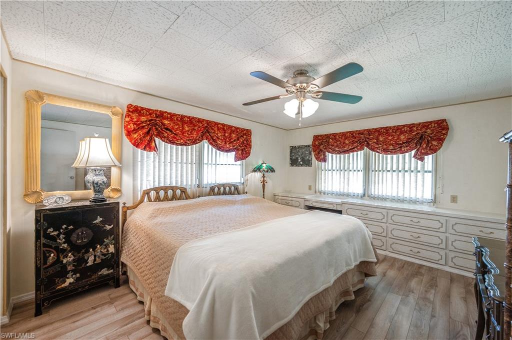 32 Monaco Terrace Naples, FL 34112 - Photo 14 of 19 a bedroom with a bed and a window