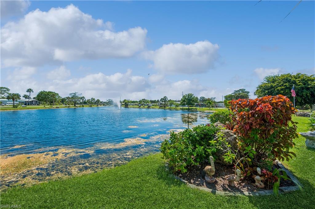 32 Monaco Terrace Naples, FL 34112 - Photo 18 of 19 a view of a lake with houses in the back