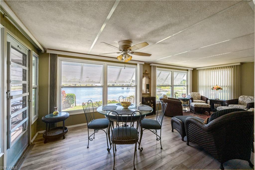 32 Monaco Terrace Naples, FL 34112 - Photo 5 of 19 a living room with furniture and a large window