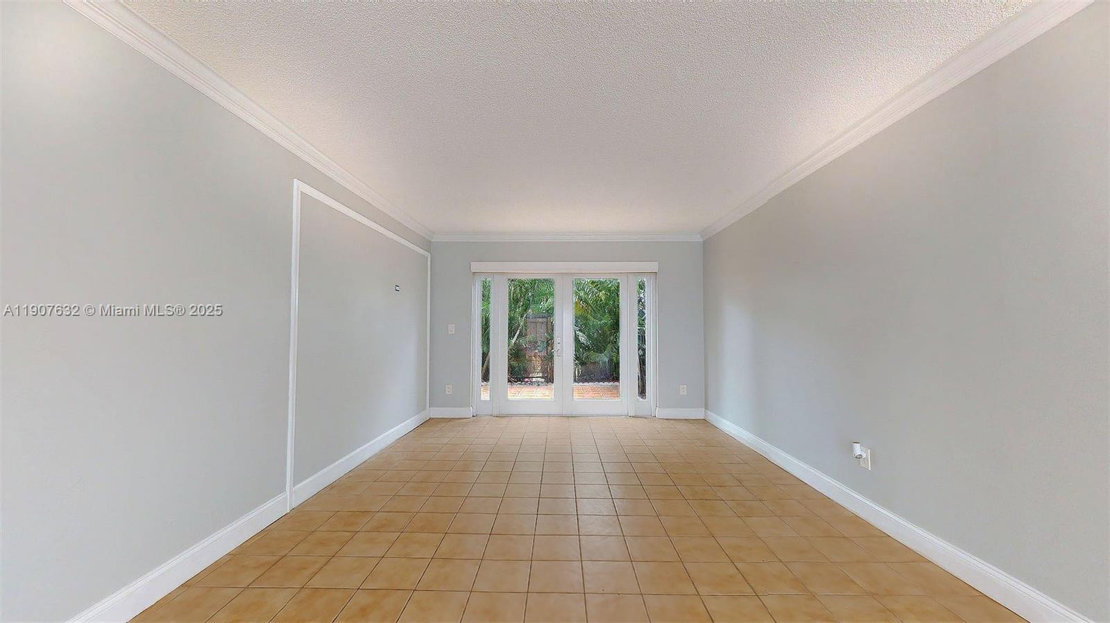 11339 Southwest 71st Street, Unit 11339 Miami, FL 33173 - Photo 14 of 28 a view of an empty room with a window