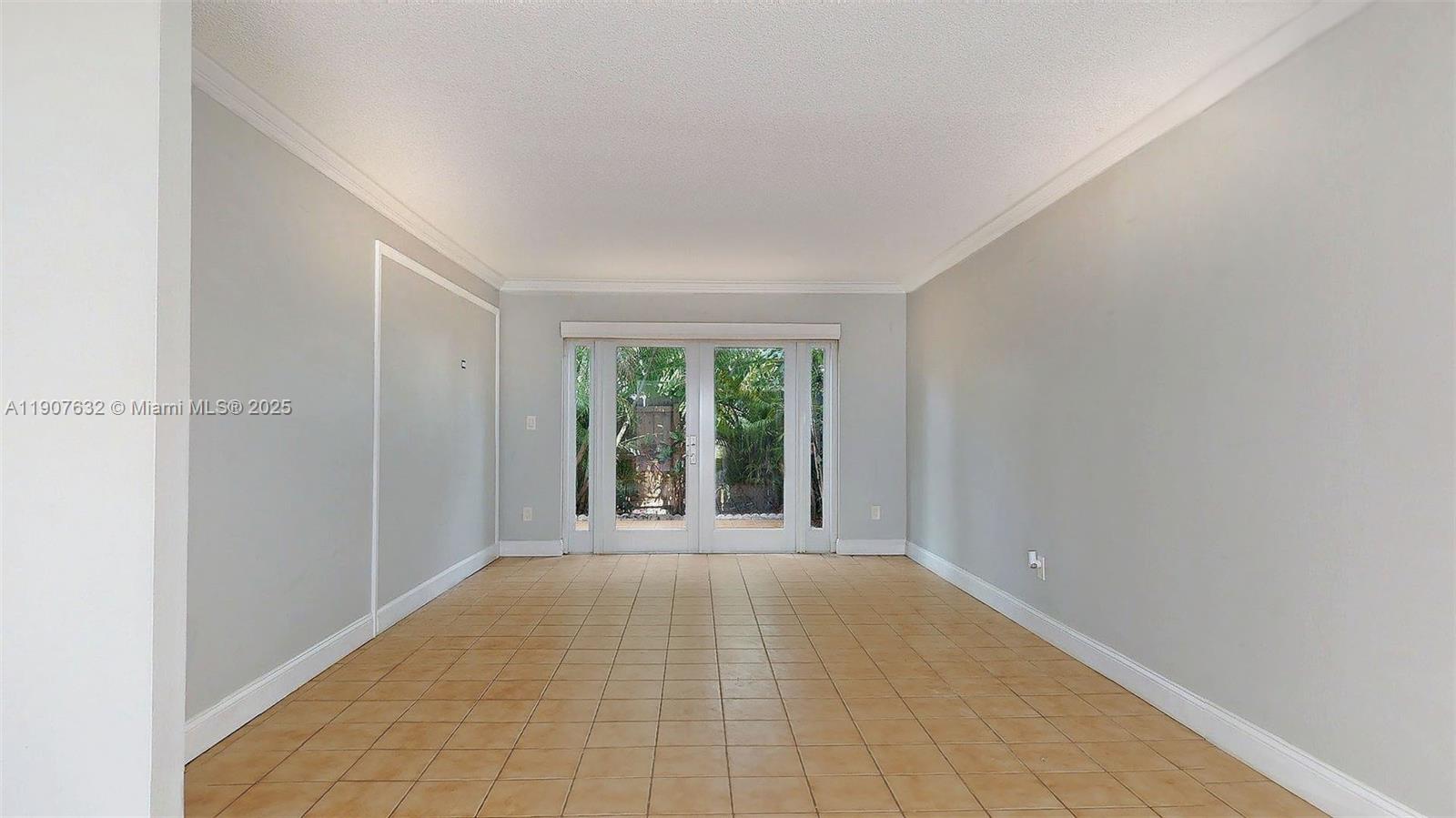 11339 Southwest 71st Street, Unit 11339 Miami, FL 33173 - Photo 16 of 28 a view of an empty room with a window