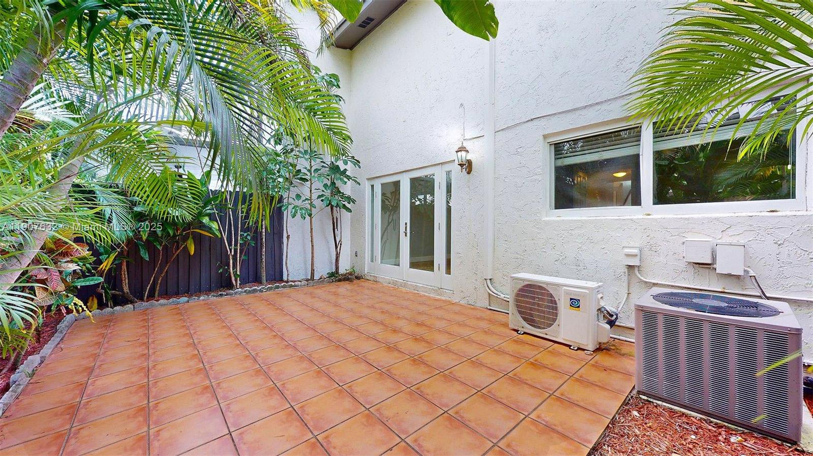 11339 Southwest 71st Street, Unit 11339 Miami, FL 33173 - Photo 19 of 28 a backyard of a house with seating space