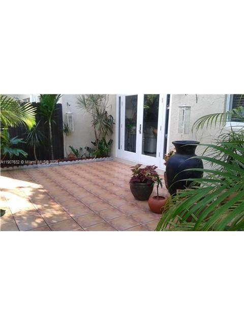 11339 Southwest 71st Street, Unit 11339 Miami, FL 33173 - Photo 21 of 28 a outdoor living space with furniture and garden