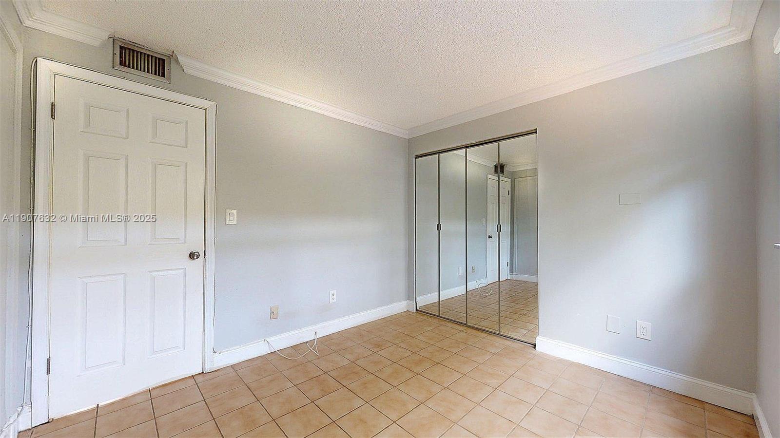 11339 Southwest 71st Street, Unit 11339 Miami, FL 33173 - Photo 22 of 28 a view of an empty room