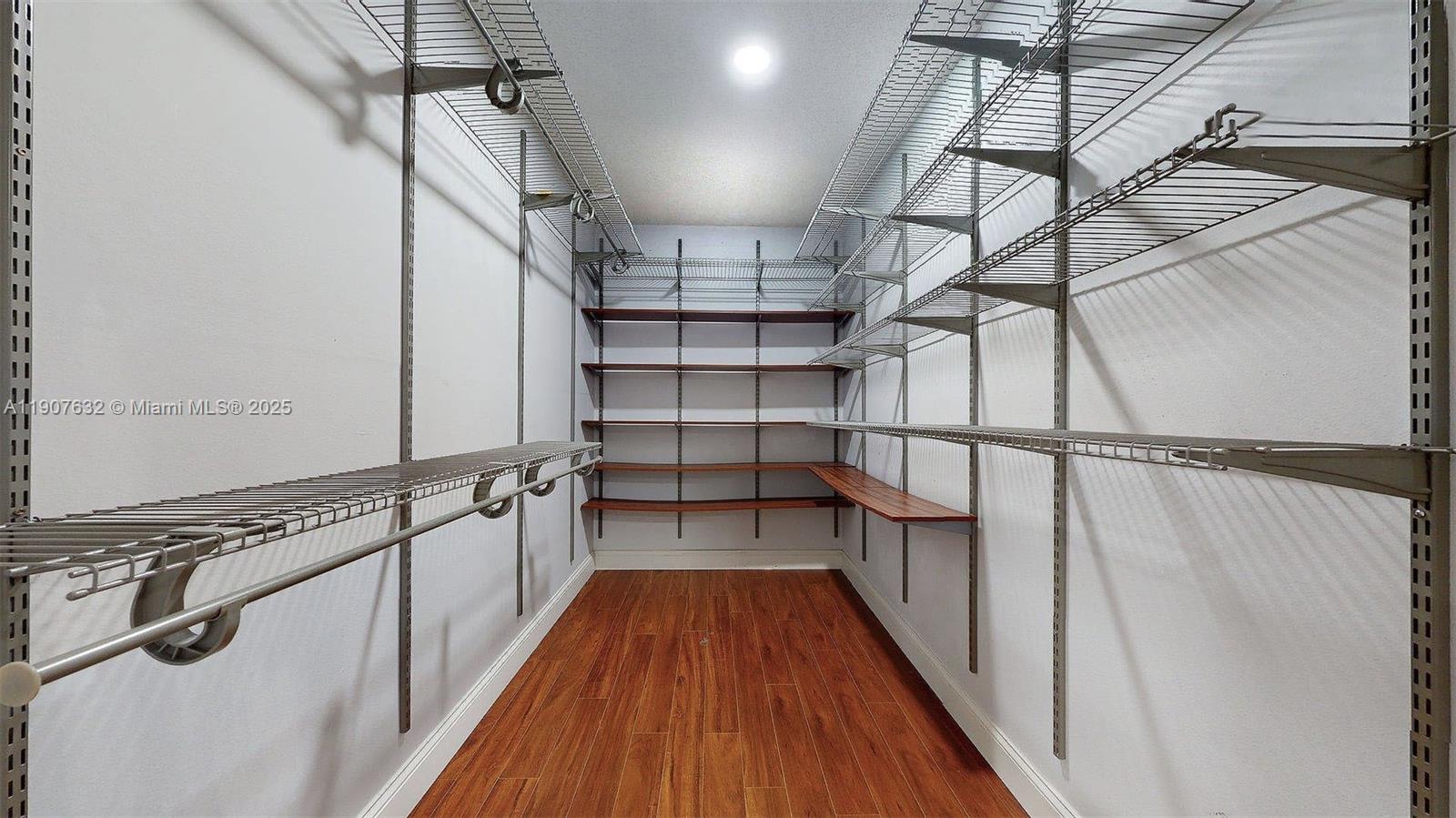 11339 Southwest 71st Street, Unit 11339 Miami, FL 33173 - Photo 7 of 28 a view of a walk in closet