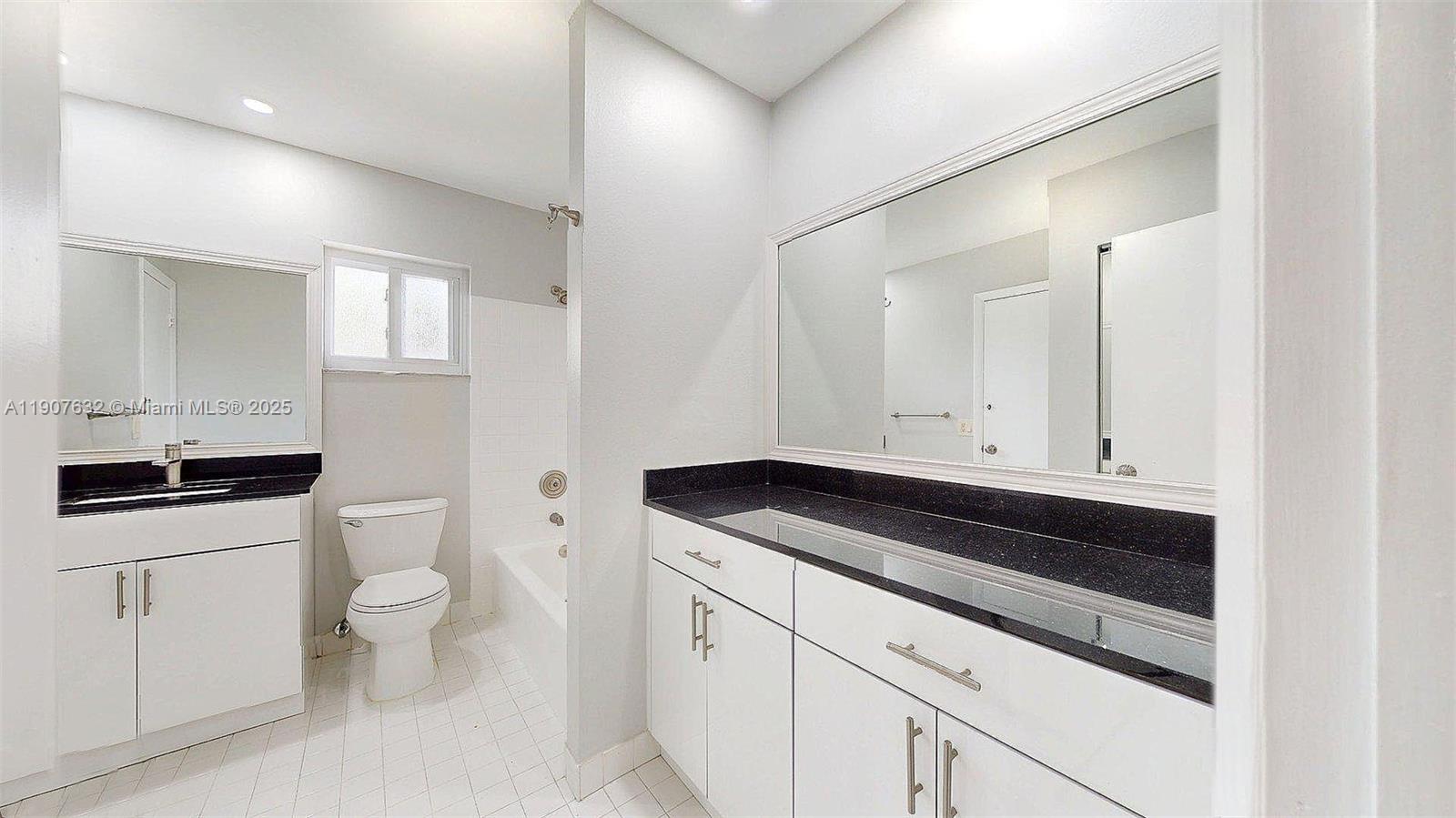 11339 Southwest 71st Street, Unit 11339 Miami, FL 33173 - Photo 8 of 28 a bathroom with a sink and a toilet