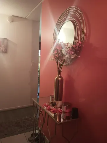 a room with a mirror and fan