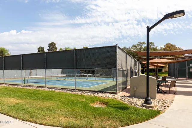 a view of a backyard with sitting area