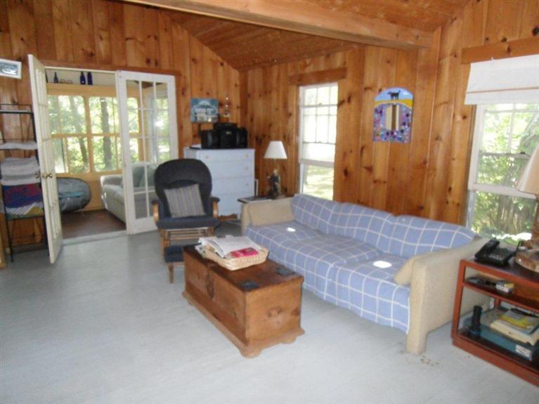 215 Pilgrim Spring Road, Unit 1 Wellfleet, MA 02667 - Photo 5 of 14 a living room with furniture and a window