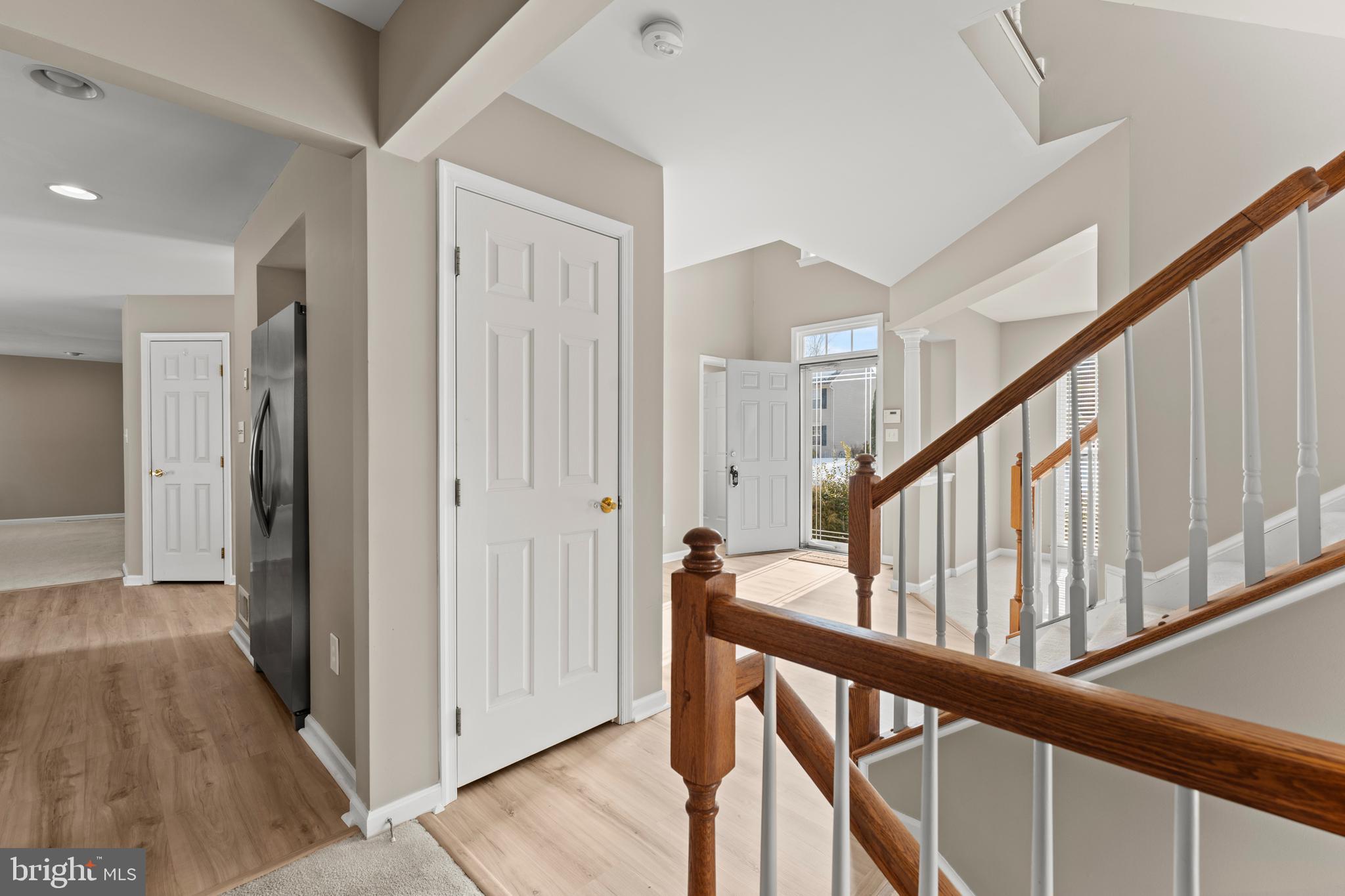 7756 Seneca Ridge Drive York, PA 17403 - Photo 12 of 50 a view of a hallway with wooden floor and staircase