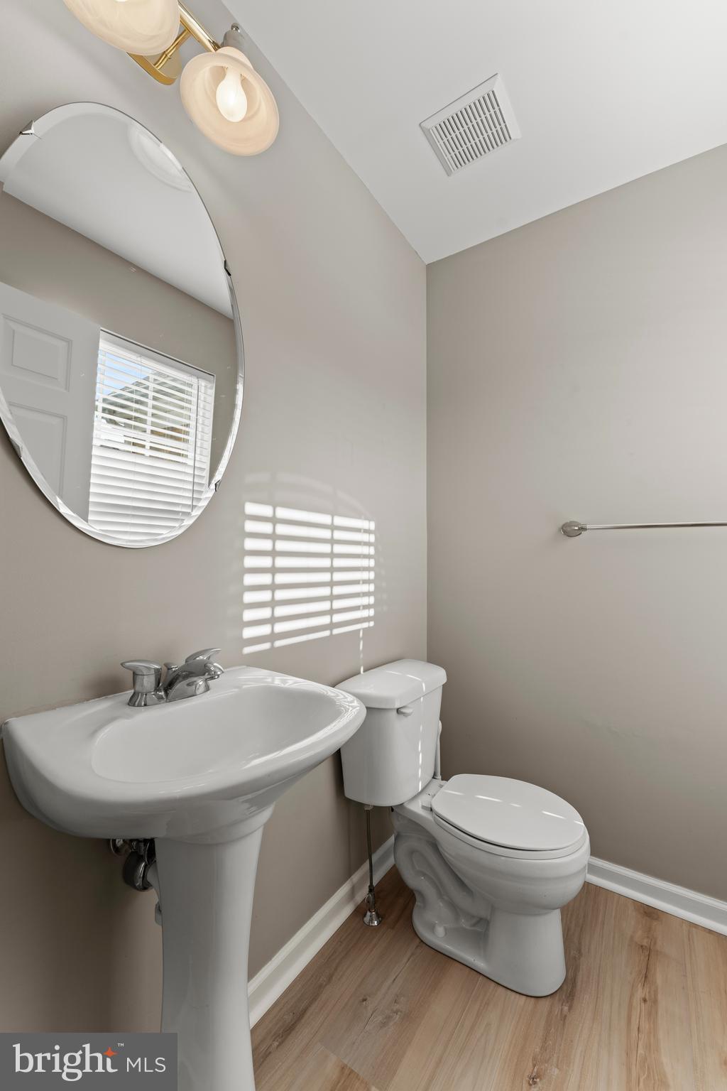 7756 Seneca Ridge Drive York, PA 17403 - Photo 13 of 50 a bathroom with a toilet a sink and mirror
