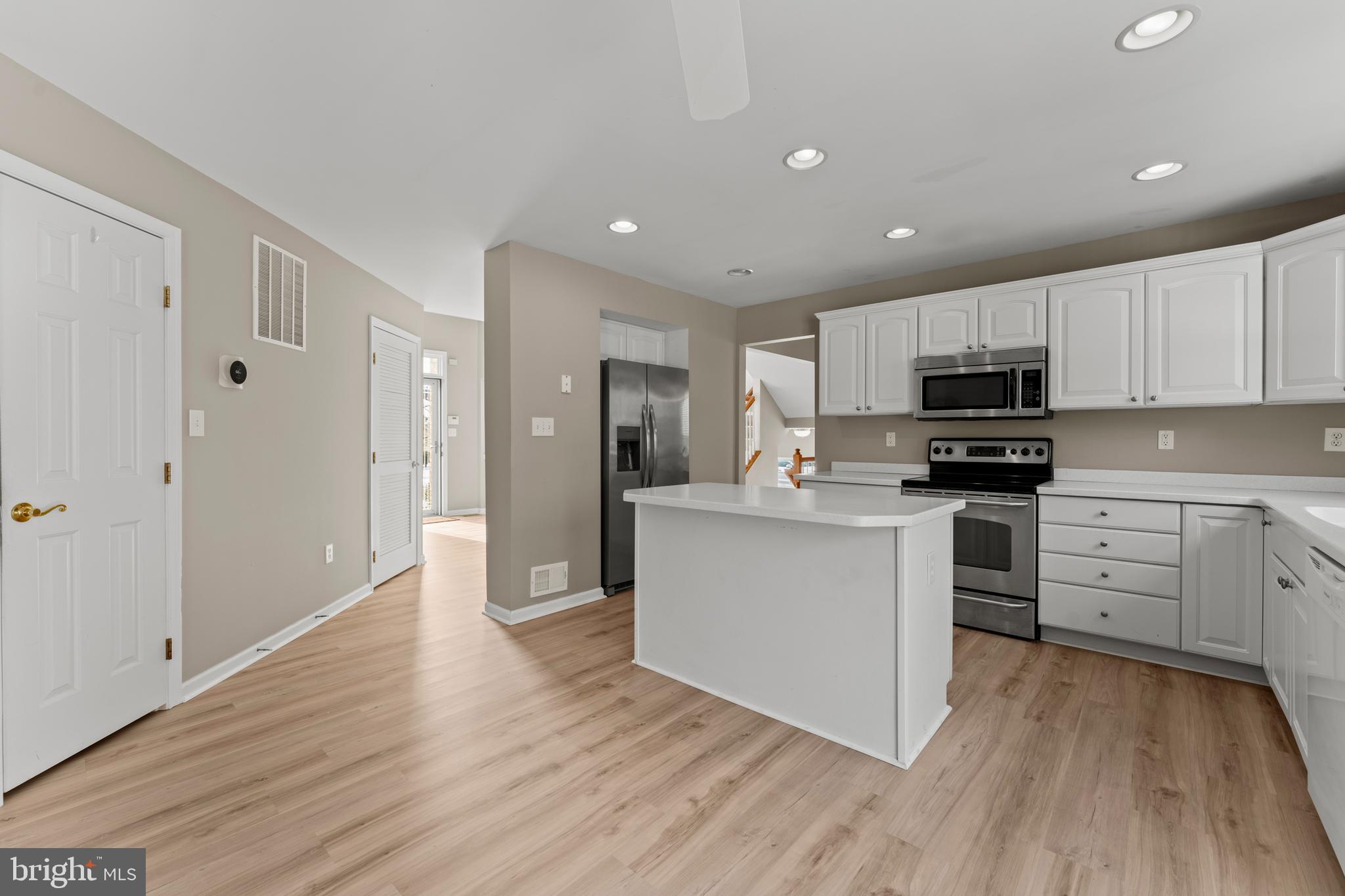 7756 Seneca Ridge Drive York, PA 17403 - Photo 18 of 50 a kitchen with granite countertop white cabinets and stainless steel appliances