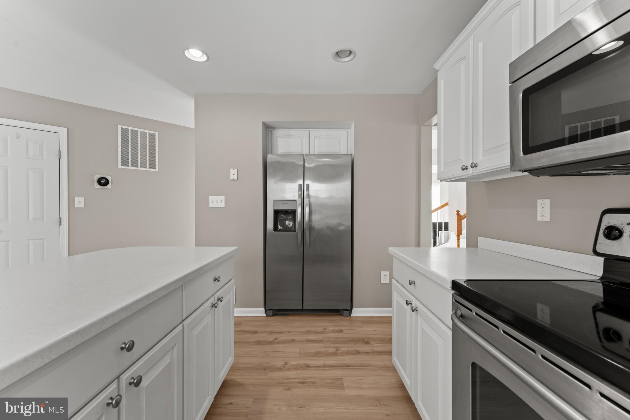 7756 Seneca Ridge Drive York, PA 17403 - Photo 20 of 50 a kitchen with stainless steel appliances granite countertop a refrigerator and a stove top oven