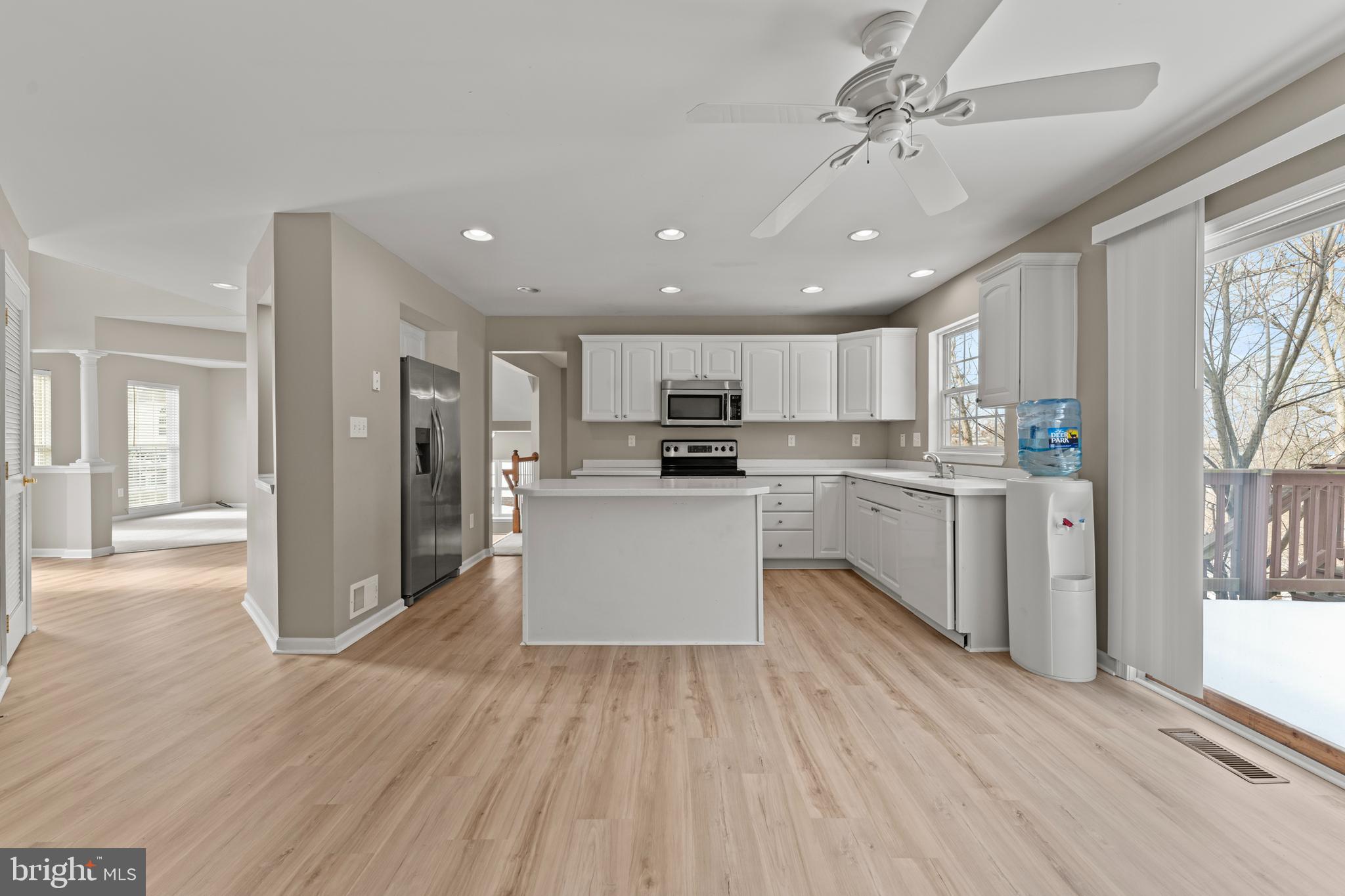 7756 Seneca Ridge Drive York, PA 17403 - Photo 25 of 50 a large kitchen with kitchen island a sink a center island stainless steel appliances and a window