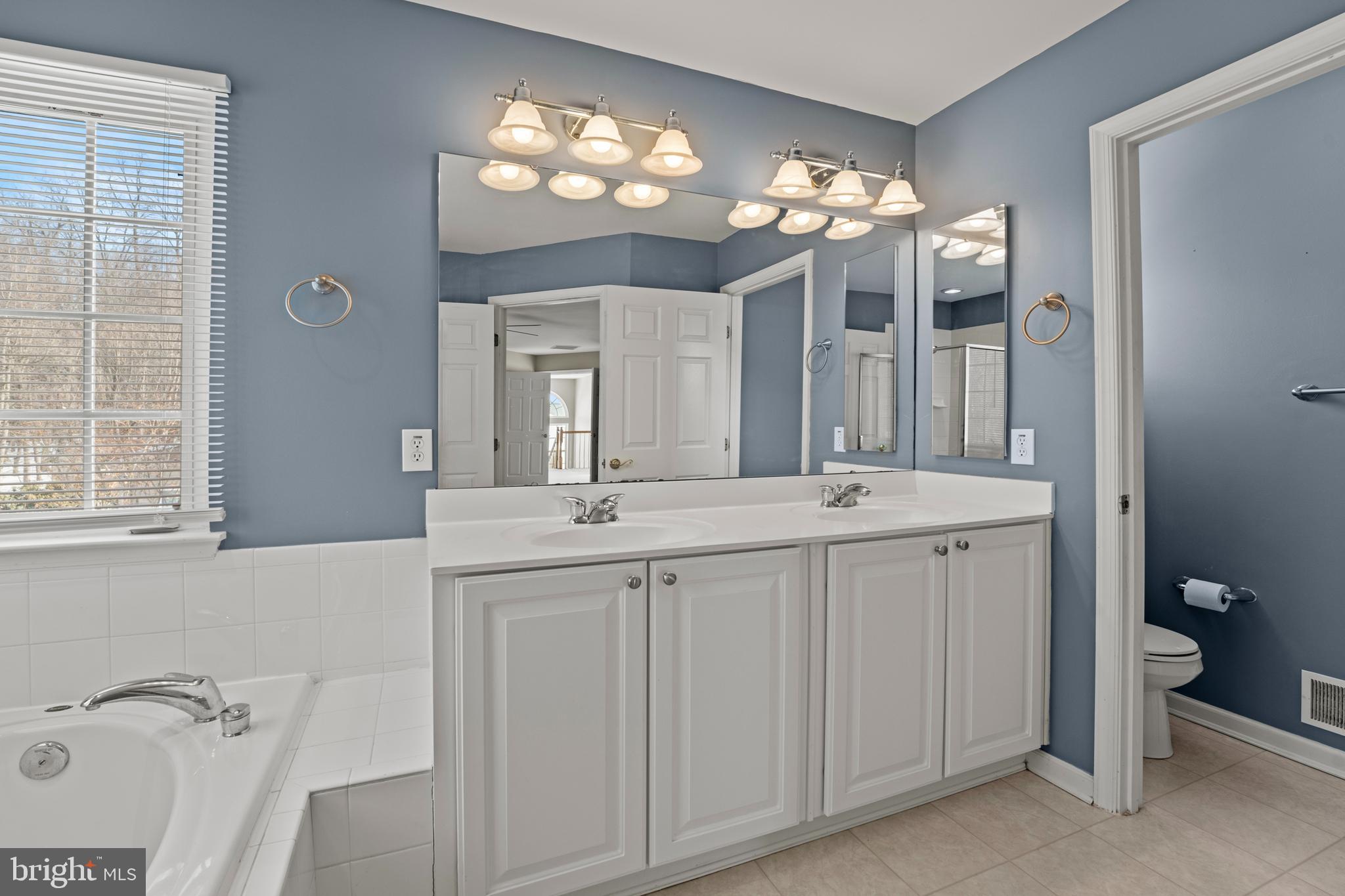 7756 Seneca Ridge Drive York, PA 17403 - Photo 39 of 50 a bathroom with a double vanity sink and a mirror