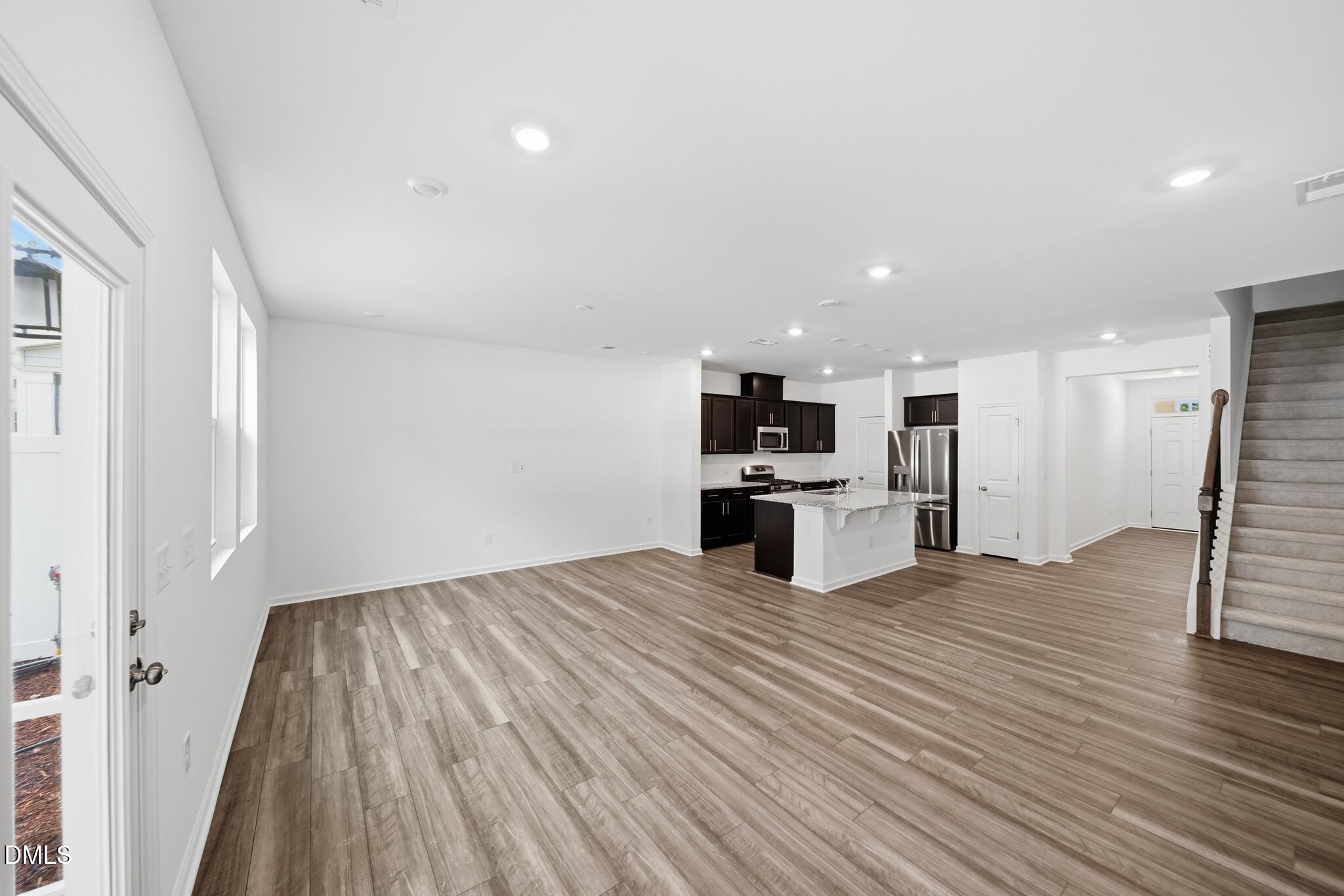 216 Tree Moss Court Rolesville, NC 27571 - Photo 4 of 31 07_216_Tree_Moss_Ct-Living_room-2083