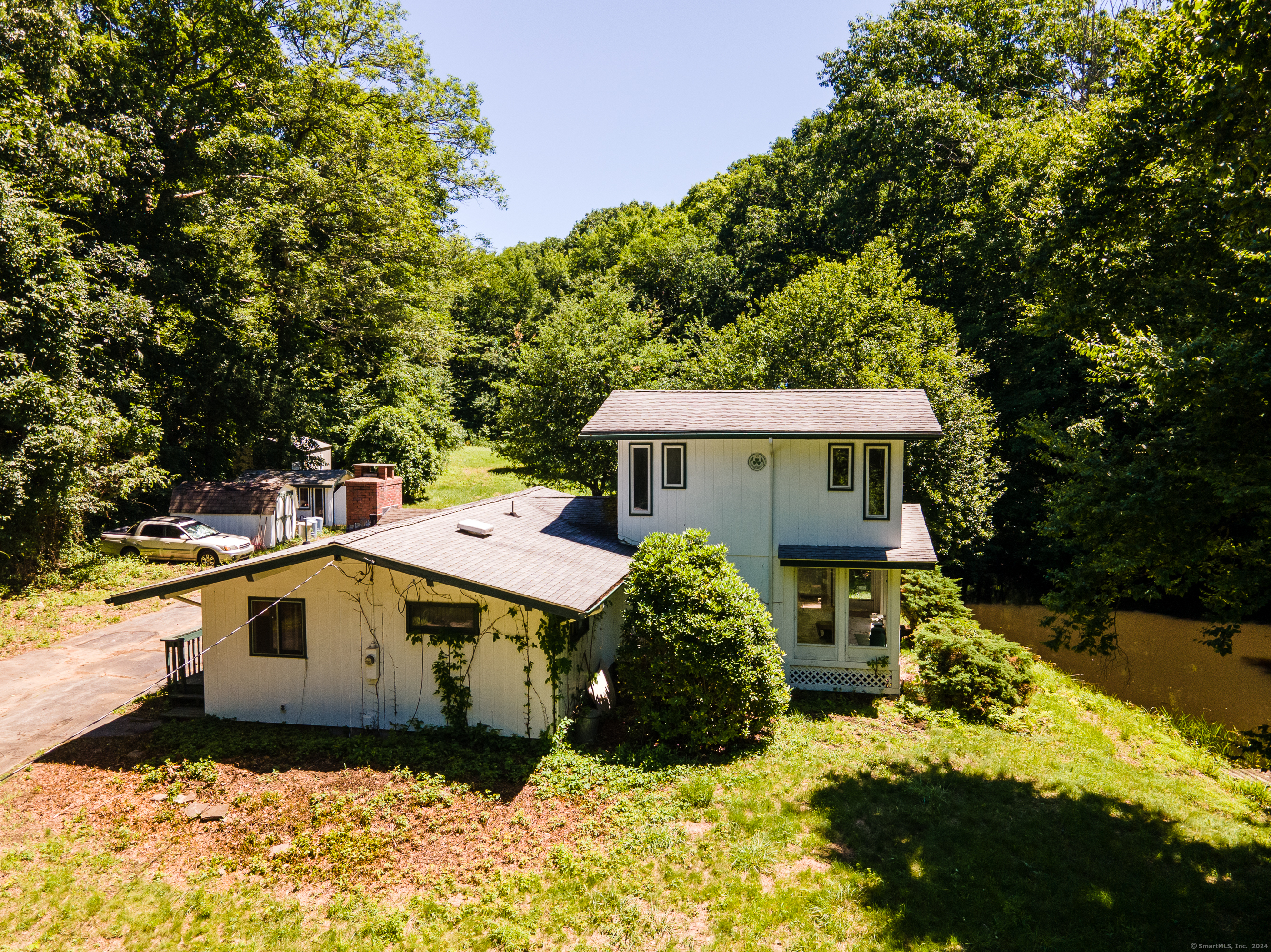 CONTEMPORARY ON 4+BEAUTIFUL SCENIC ACREAGE IN PRIVATE SETTING WITH POND