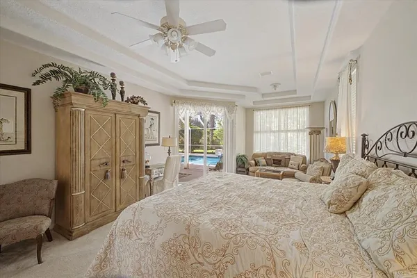 a spacious bedroom with a bed and a window