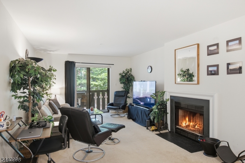 609 Mark Twain Way Mahwah, NJ 07430 - Photo 12 of 40 a living room with furniture and a fireplace