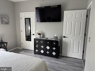 1581 Spring Gate Dr., Unit 5403 McLean, VA 22102 - Photo 15 of 16 a living room with a fireplace furniture and a flat screen tv