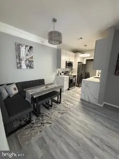 a living room with furniture and a piano