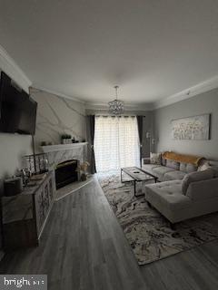 1581 Spring Gate Dr., Unit 5403 McLean, VA 22102 - Photo 7 of 16 a living room with furniture a flat screen tv and a fireplace